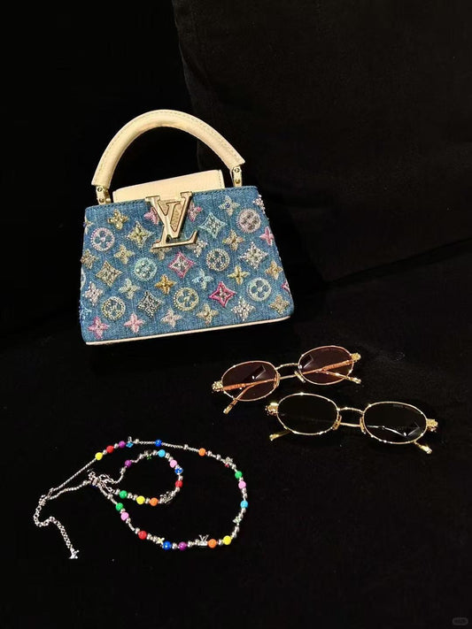 Lyxig denim-utsmyckade Capucines-miniväska